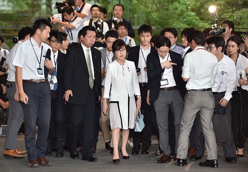 Newly appointed Japanese Defense Minister Tomomi Inada (C) is surrounded by the media during a visit to the prime minster's official residence in Tokyo on August 3, 2016. (AFP Photo)