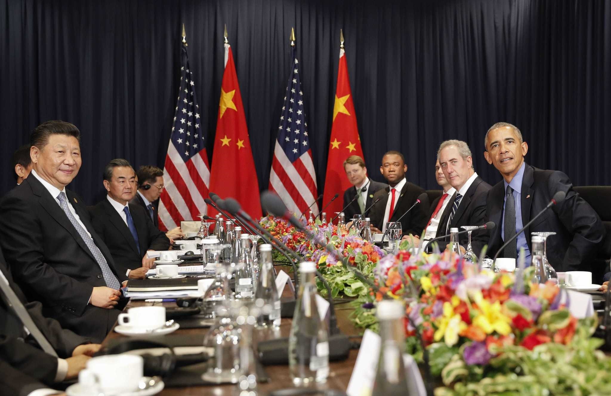 U.S. President Barack Obama (R) with Chinau2019s President Xi Jingping and members of their delegations, during their meeting as part of the Asia-Pacific Economic Cooperation (APEC) in Lima, Peru.