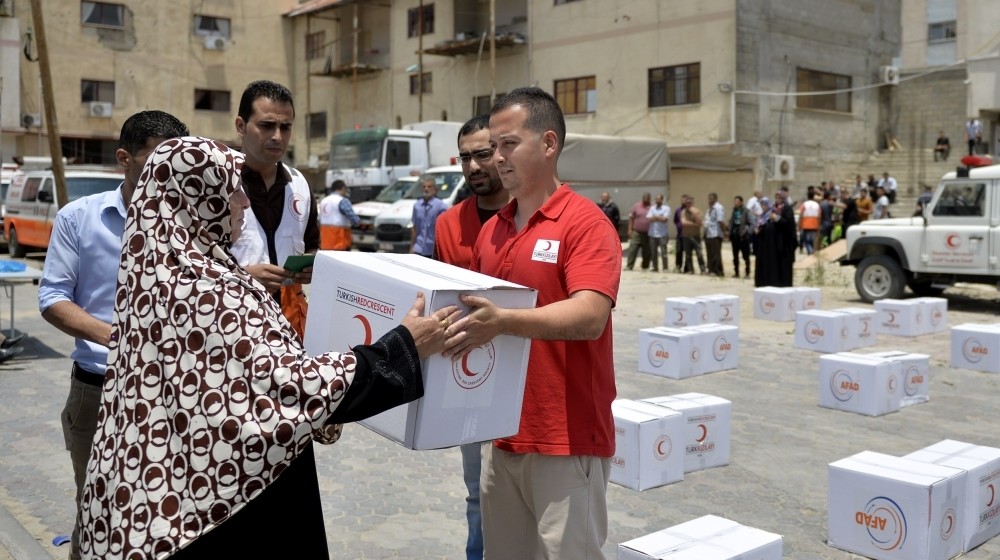 Turkish Red Crescent officials deliver aid to Palestinian families in Gaza.