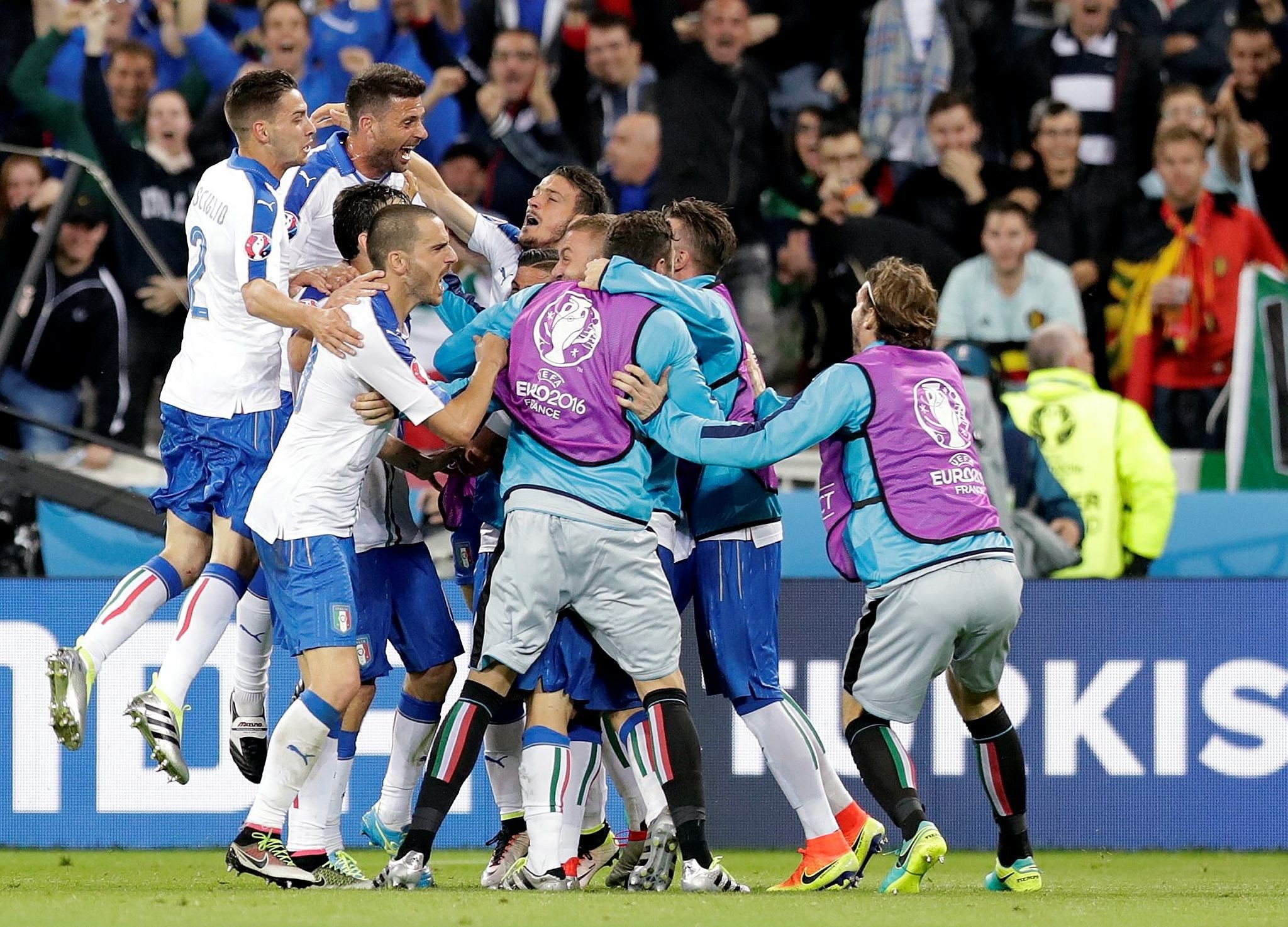 Italian players celebrate after scoring their second goal during the Euro 2016 Group E soccer match between Belgium and Italy in Lyon, France, Monday, June 13, 2016. (AP Photo)