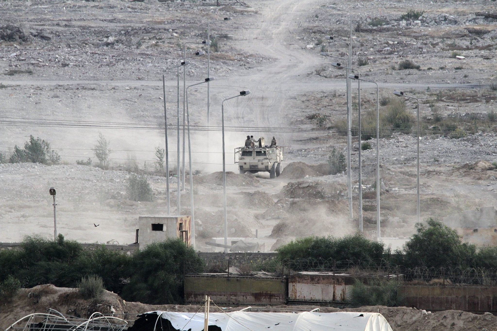 Egyptian soldiers sit atop a military personnel carrier securing the Egyptian side of the border between Egypt and Rafah in the southern Gaza Strip, Wednesday, July 1, 2015. (AP Photo)