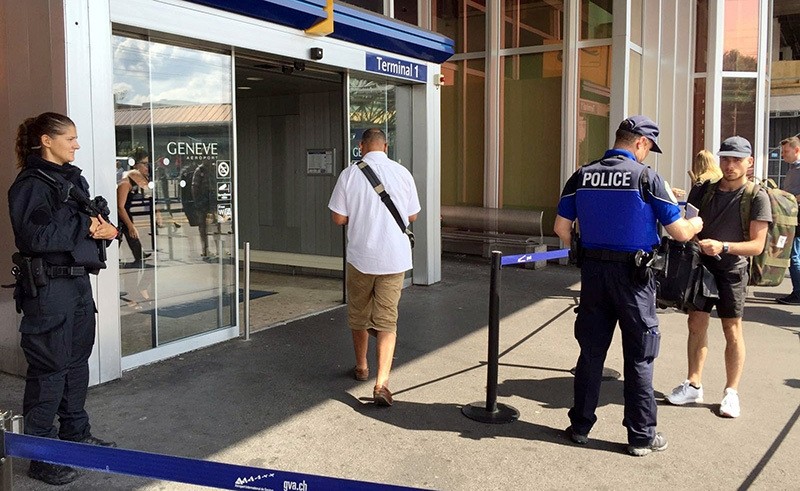 Swiss police officers conduct checks on passengers at the entrance of the Cointrin airport in Geneva, Switzerland July 27, 2016 (Reuters Photo)