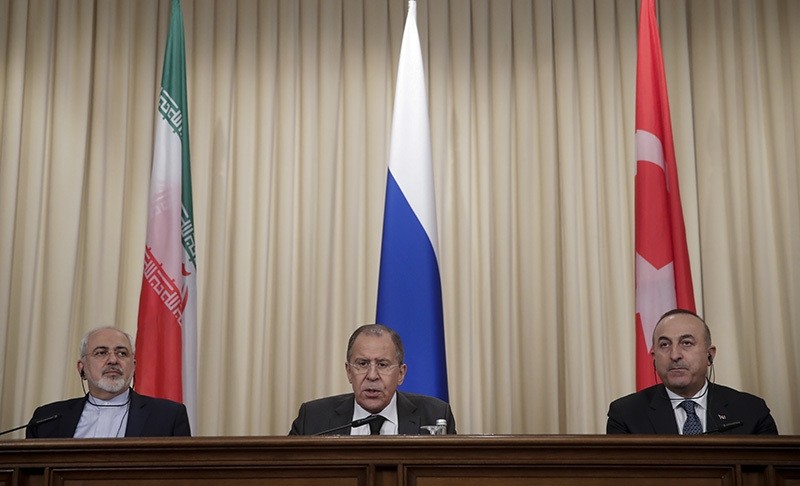 Iranian FM Zarif, left, Russian FM Lavrov, center, and Turkey's FM u00c7avuu015fou011flu, join news conference after their talks in Moscow, Russia, Tuesday, Dec. 20, 2016 (AP Photo)