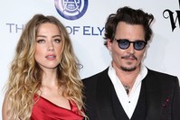 In this Jan. 9, 2016 file photo, Amber Heard, (L), and Johnny Depp arrive at The Art of Elysium's Ninth annual Heaven Gala at 3LABS, in Culver City, Calif. (AP)