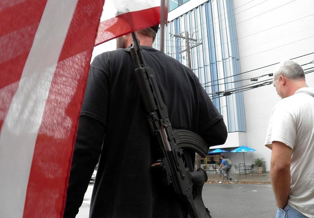 Pro-gun advocates take to the streets outside the University of Texas ahead of a 'mock mass shooting' event (Reuters Photo)