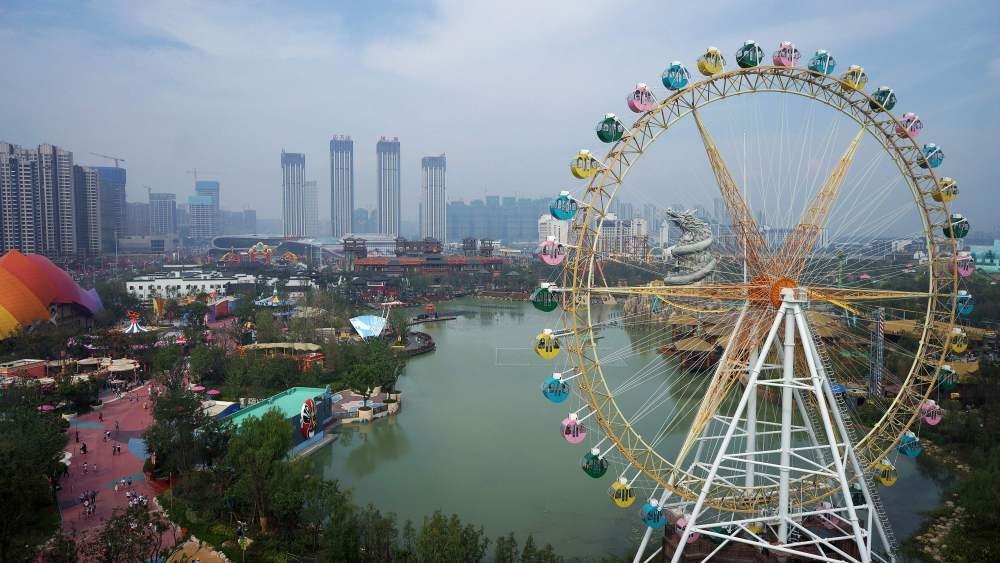 People visit the newly opened theme park u2018Hefei Wanda Culture Tourism Cityu2019 in Hefei, east Chinau2019s Anhui province.