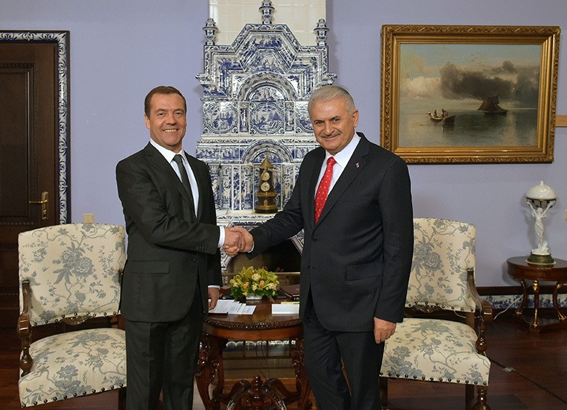 Russian Prime Minister Dmitry Medvedev, left, meets with Turkish Prime Minister Binali Yildirim at the Gorki residence outside Moscow on Tuesday, Dec. 6, 2016. (AP Photo)
