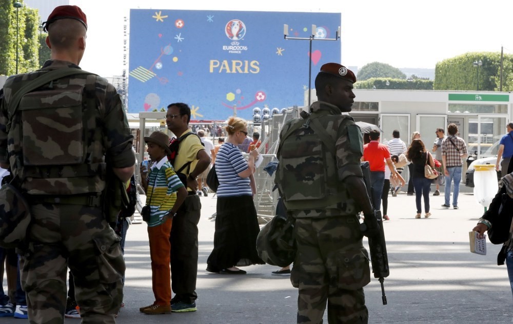 French military patrol at a fan zone near the Eiffel Tower before the start of the UEFA 2016 European Championship in Paris, France, June 7.