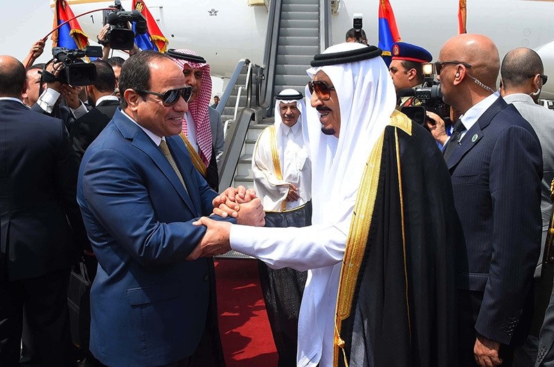 In this Monday, April 11, 2016 file photo provided by the office of the Egyptian Presidency, Egyptian President Abdel-Fattah el-Sissi, left, shakes hands with Saudi Arabia's King Salman before he departs Egypt. (AP Photo)