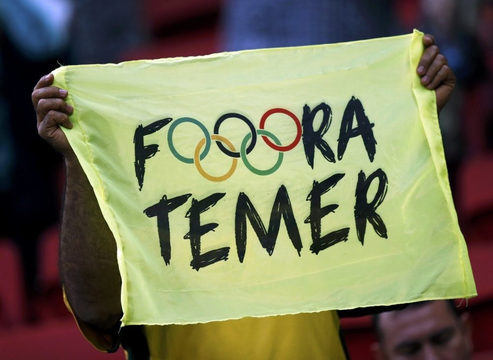 A banner reads ,Out Temer, in reference to the interim Brazilian President Michel Temer.