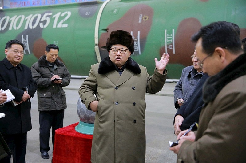 North Korean leader Kim Jong Un meets scientists and technicians in the field of research into nuclear weapons in this undated photo released by North Korea's Korean Central News Agency (KCNA) in Pyongyang, March 9, 2016. (Reuters Photo)