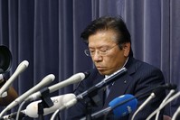 Mitsubishi Motors Corp. President Tetsuro Aikawa listens to a reporter's question during a press conference in Tokyo. (AP Photo)