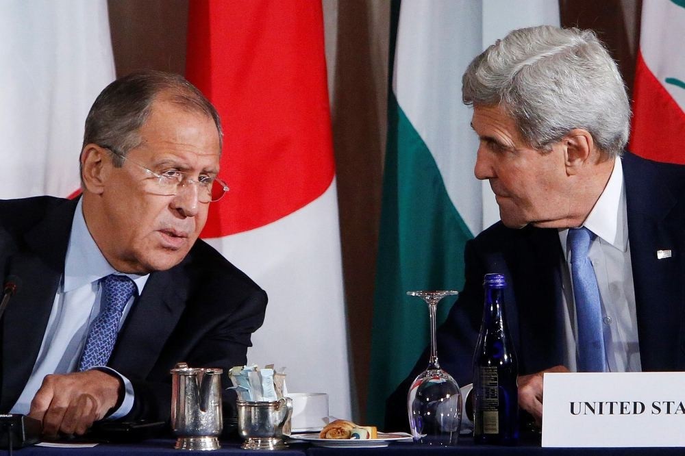 Russia's Foreign Minister Sergey Lavrov and United States Secretary of State John Kerry talk during a meeting at the International Syria Support Group, Sept. 22 in New York.