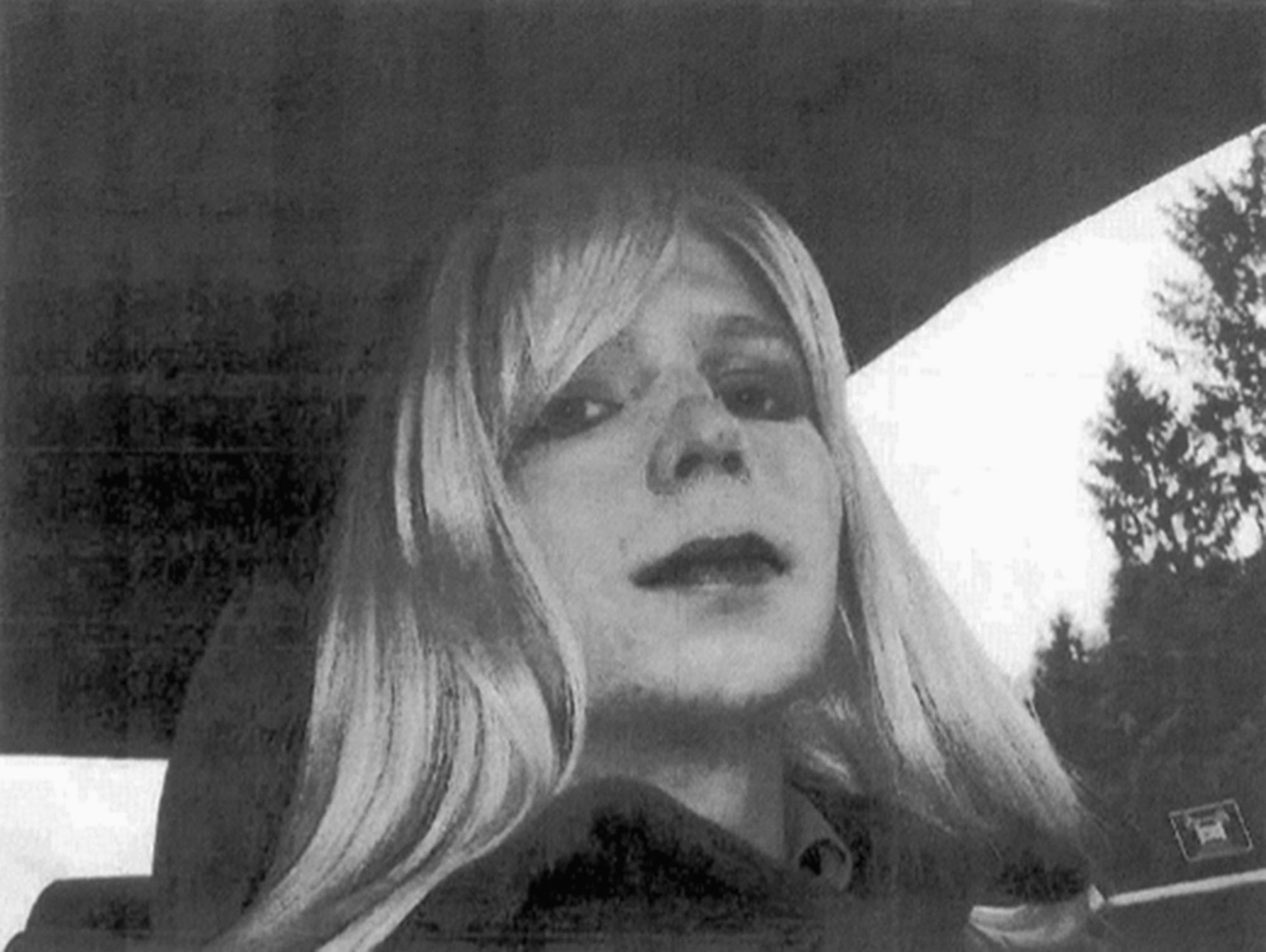 In  this undated file photo provided by the U.S. Army, Pfc. Chelsea Manning poses for a photo wearing a wig and lipstick. (AP Photo)