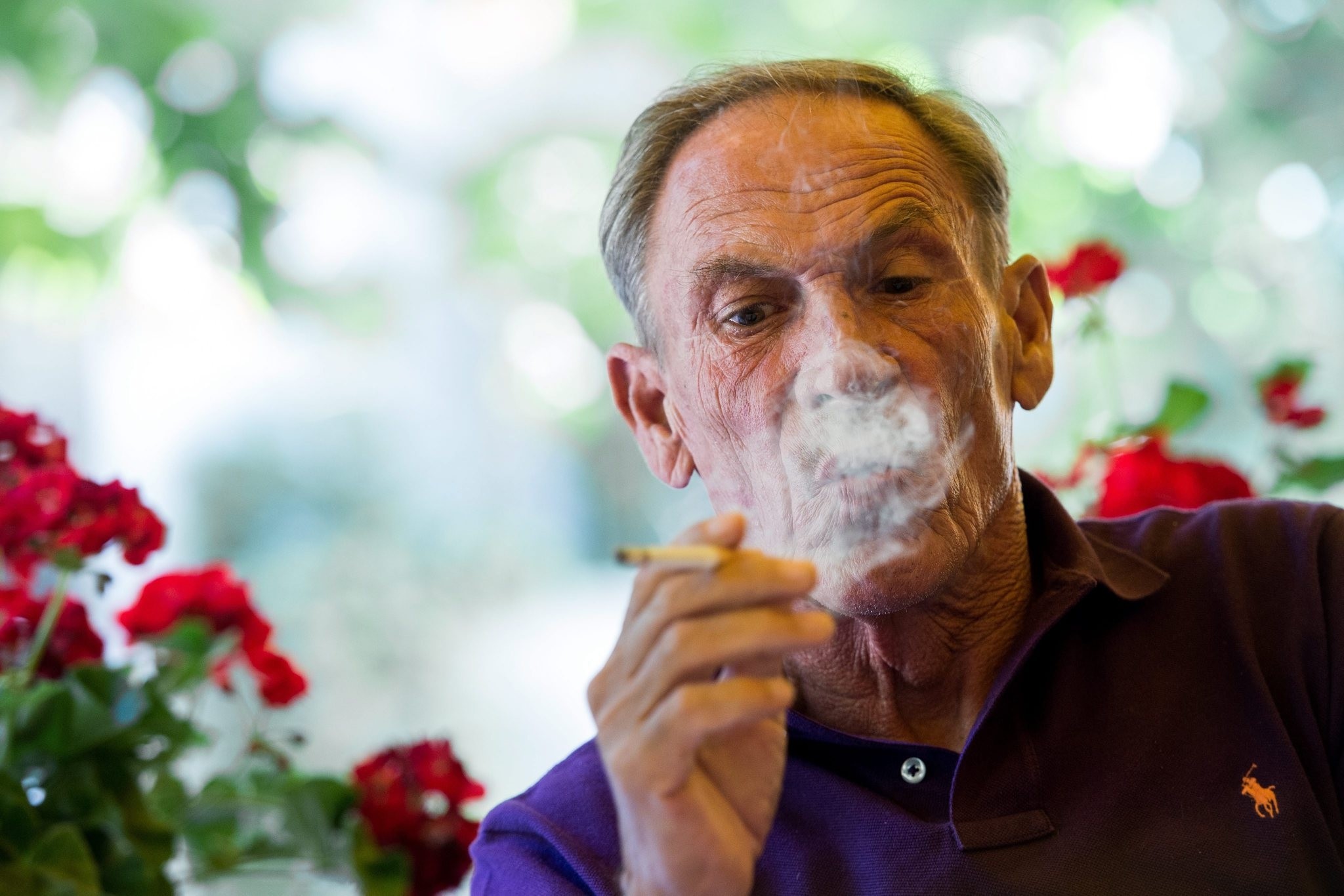 FC Lugano presents the new coach Zdenek Zeman, pictured while smoking, in Lugano southern part of Switzerland, on Wednesday June 17 2015. (EPA Photo)