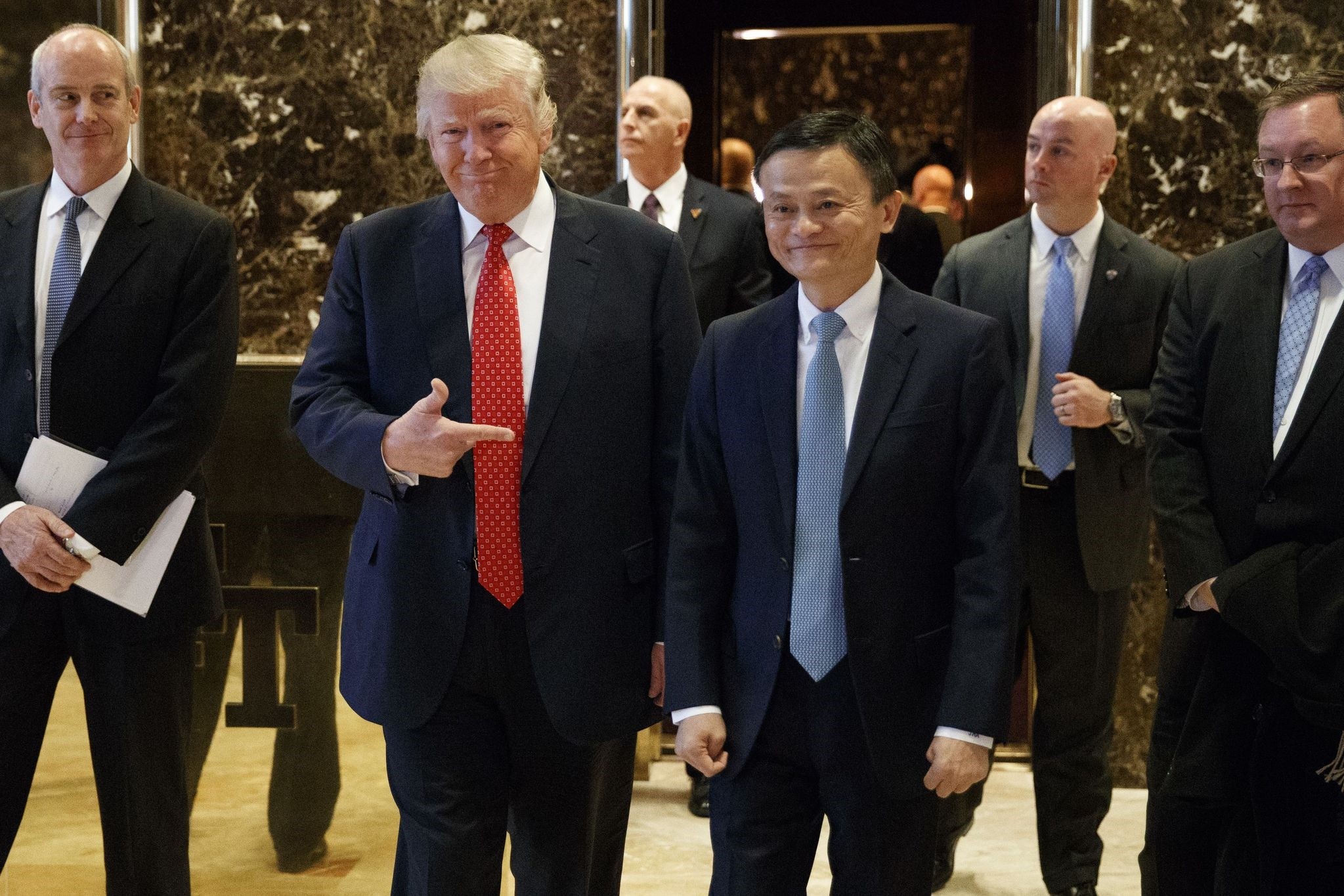 Jack Ma (R), founder and executive chairman of Alibaba Group, and President-elect Donald Trump speak to the media after their meeting at Trump Tower in New York.