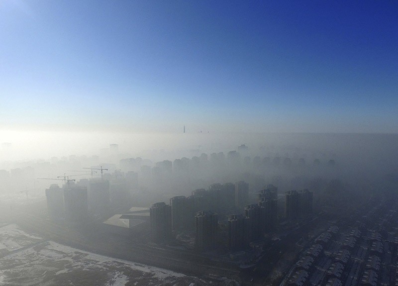 Smog is seen over the city against sky during a haze day in Tianjin, China, Jan. 2, 2017. (Reuters Photo)