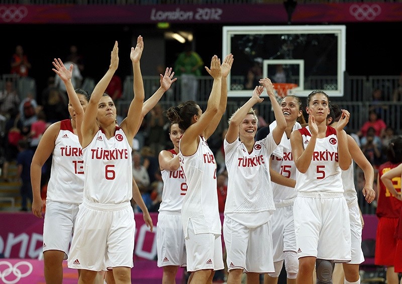 Players celebrate victory against China after their women's preliminary round Group A basketball match at the Basketball Arena during London 2012 Olympic Games (Reuters)