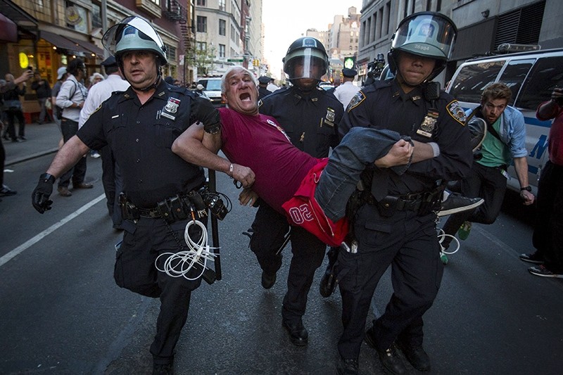 A protester is detained by New York police during a demonstration calling for social, economic and racial justice, in the Manhattan borough of New York City April 29, 2015 (Reuters Photo)