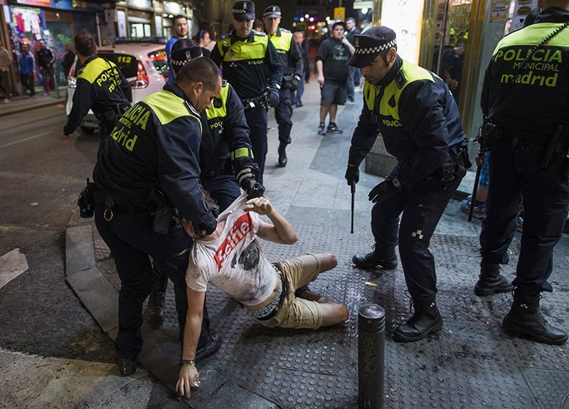 Spanish police arrest a troublemaker in Madrid, 2015 (AP Photo)