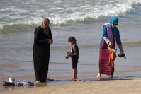 In this Friday, Sept. 2, 2016 photo, Muslim women stand at a beach in Tel Aviv, Israel. (AP Photo)