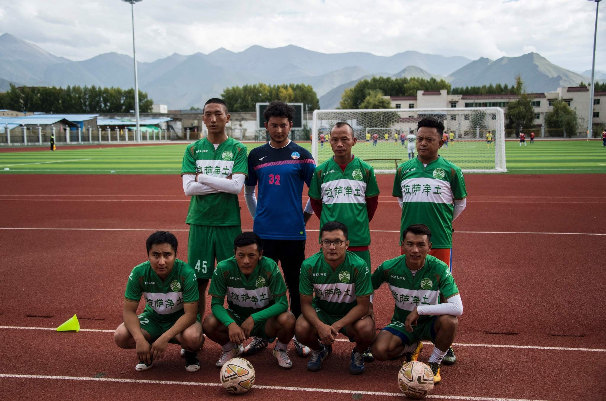 Members of the Lhasa Pureland Football Club pose for a group picture at their football stadium in the regional capital Lhasa, in Chinau2019s Tibet Autonomous Region.