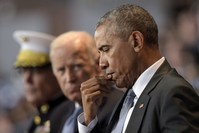 President Barack Obama listens as Defense Secretary Ash Carter speaks during an Armed Forces Full Honor Farewell Review for the President at Conmy Hall. (AP Photo)