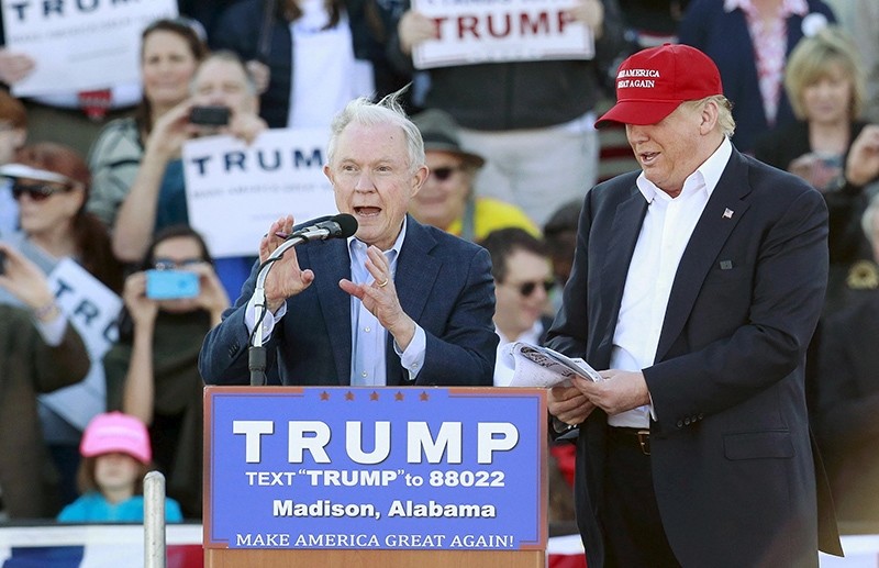 U.S. Senator Jeff Sessions speaks next to U.S. Republican presidential candidate Donald Trump at a rally at Madison City Schools Stadium in Madison (Reuters Photo)