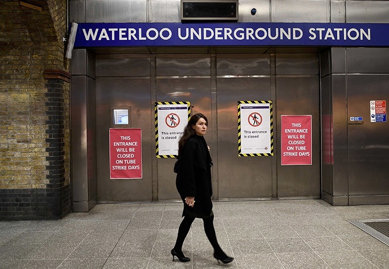A woman walks past the closed entrance to the Underground station at Waterloo during a strike by members of two unions in protest at ticket office closures and reduced staffing levels, in London, Britain January 9, 2017. (Reuters Photo)