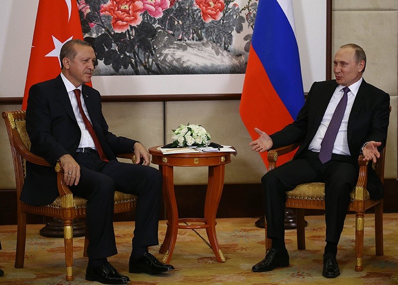 Russian President Vladimir Putin, right, and Turkish President Recep Tayyip Erdou011fan speak during their meeting ahead of the G20 Summit in Hangzhou, China, Saturday, Sept. 3, 2016. (Yasin Bu00fclbu00fcl, Presidential Press Service, Pool via AP)