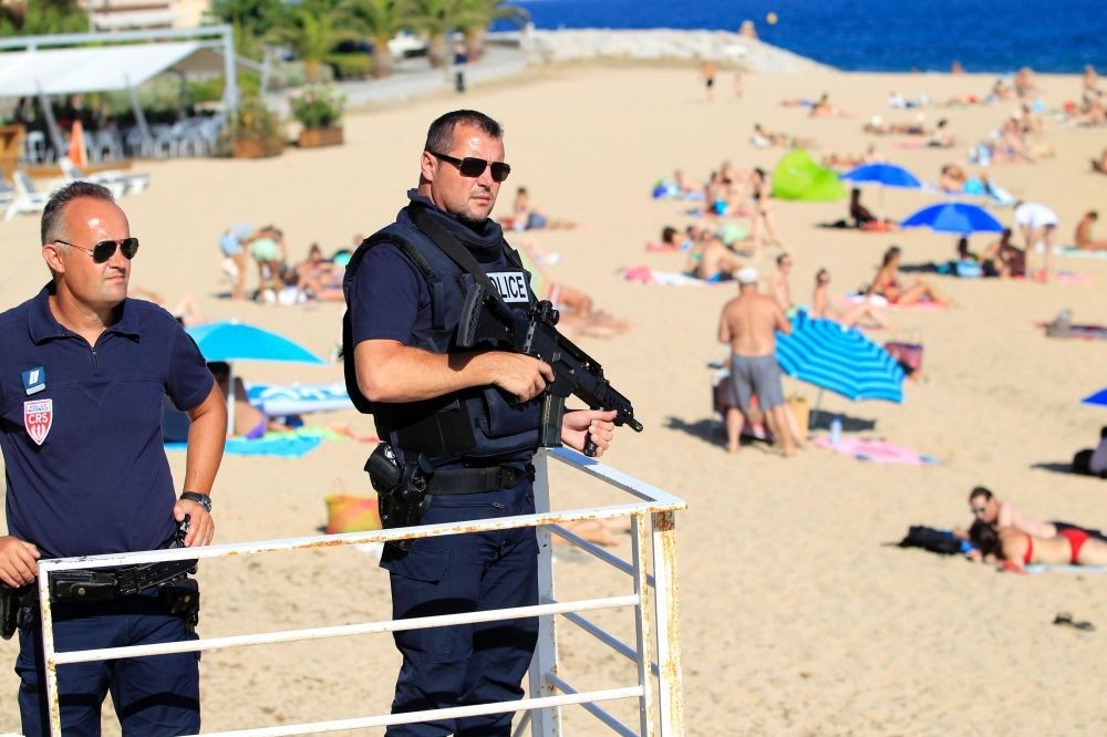 French police patrol a beach in Ajaccio on the French Mediterranean island of Corsica, Aug. 1. 