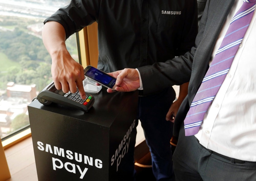 Samsung's new Samsung Pay mobile wallet system is demonstrated at its Australian launch in Sydney.