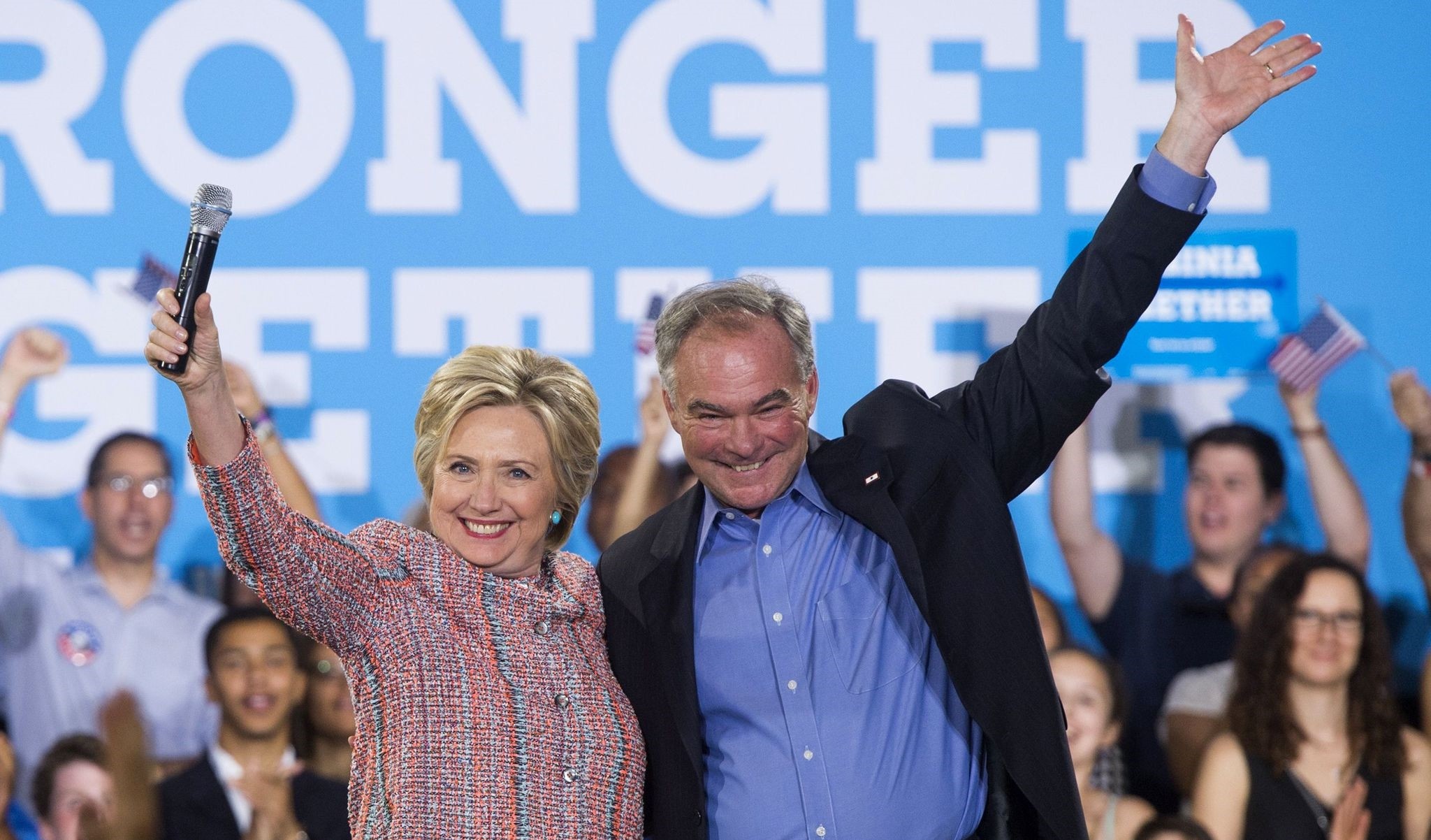 Hillary Clinton and US Senator Tim Kaine waving during a campaign rally in Annandale, Virginia. (AFP Photo)
