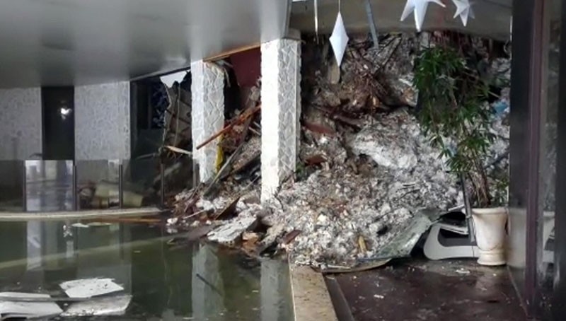 This photo taken from a video shows show piles of snow and rubble cascading down the stairway into the foyer of the hotel Rigopiano in Farindola, Italy, early Thursday, Jan. 19, 2017. (AP Photo)