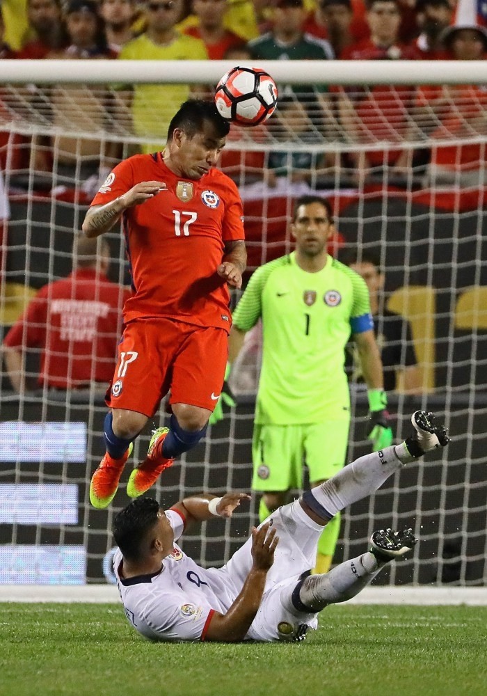 Gary Medel of Chile heads the ball
