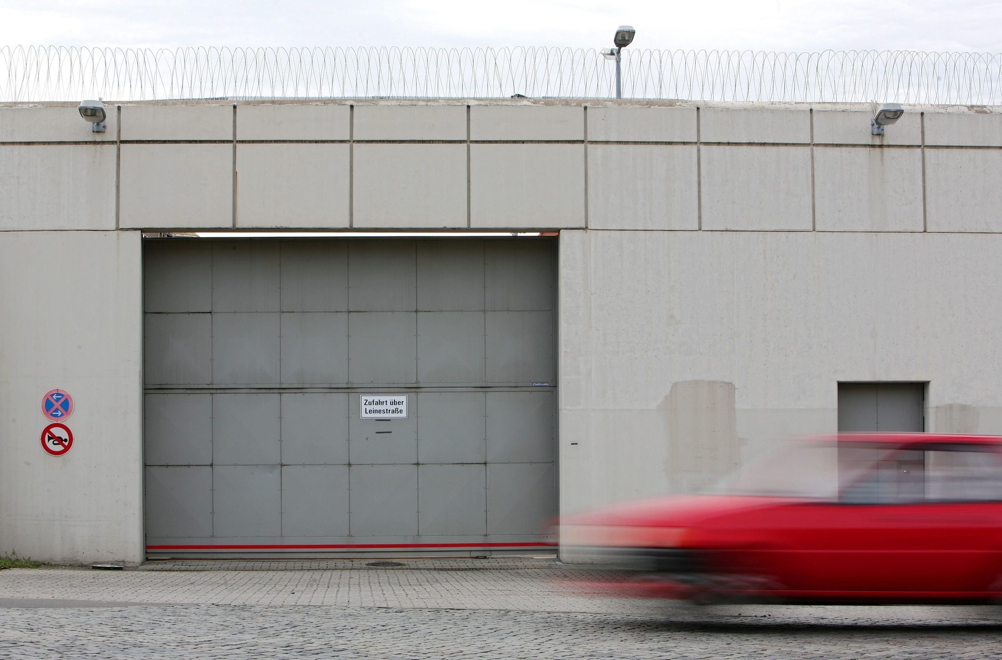 A file photo dated 06 March 2007 of a car passing by in front of the entrance gate of the correctional facility (JVA) Leipzig, in Leipzig, Germany. (EPA Photo)