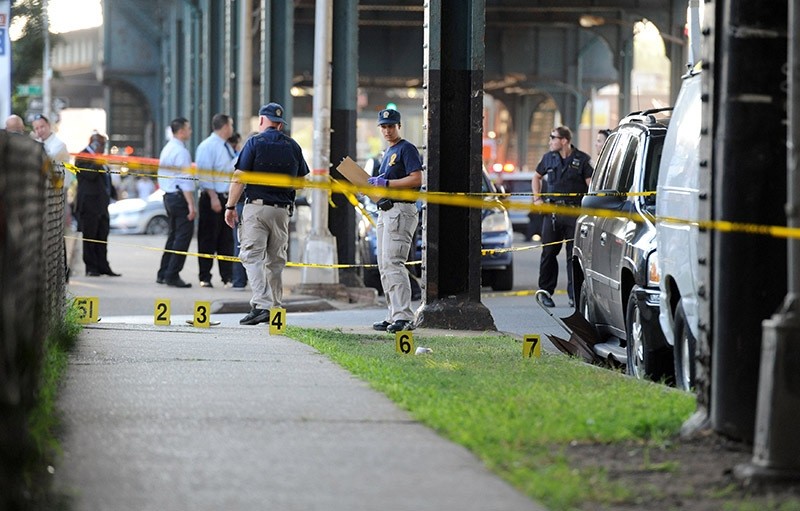 Members of the New York City Police Department establish a crime scene at the spot where Imam Alala Uddin Akongi was killed. (Reuters Photo)