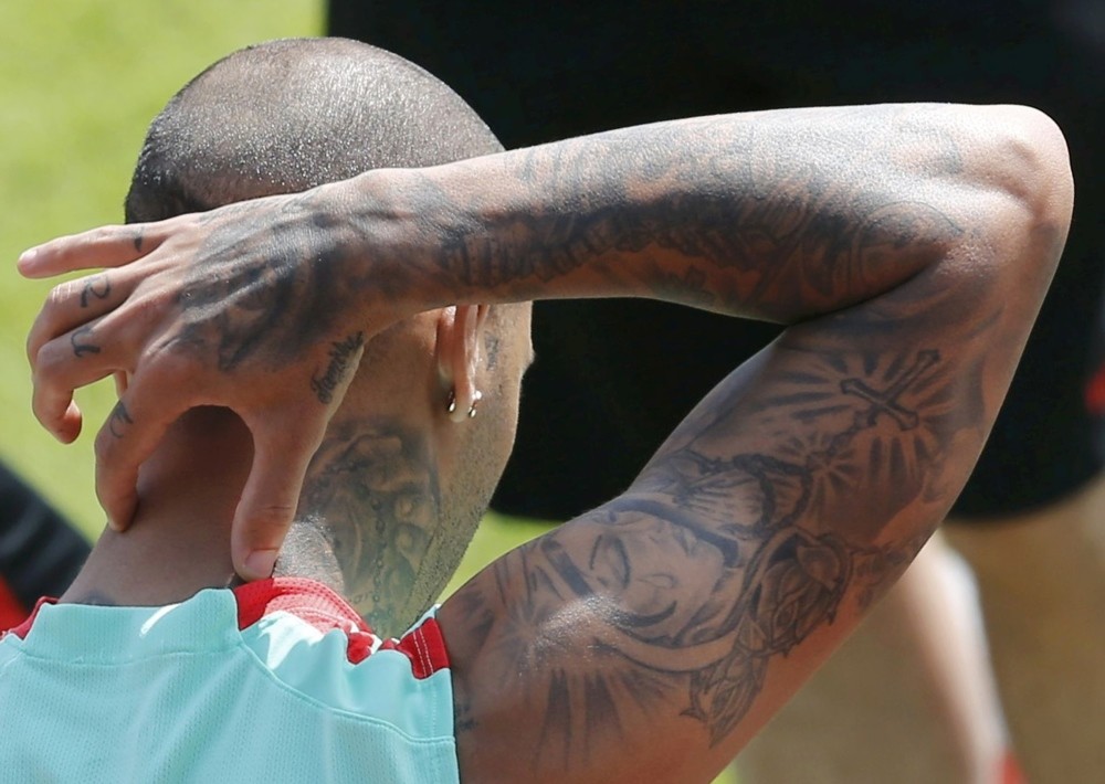 Tatoos on Portugalu2019s player Ricardo Quaresmau2019s arm.
