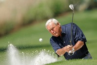 Former champion Arnold Palmer of the U.S hits from a sand trap during the annual Masters Par 3 golf tournament at the Augusta National Golf Club in Augusta (Reuters Photo)