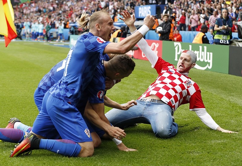 A Croatia fan celebrates on the pitch after Luka Modric scores their first goal against Turkey on June 12, 2016 at the Parc des Princes Stadium. (Reuters Photo)
