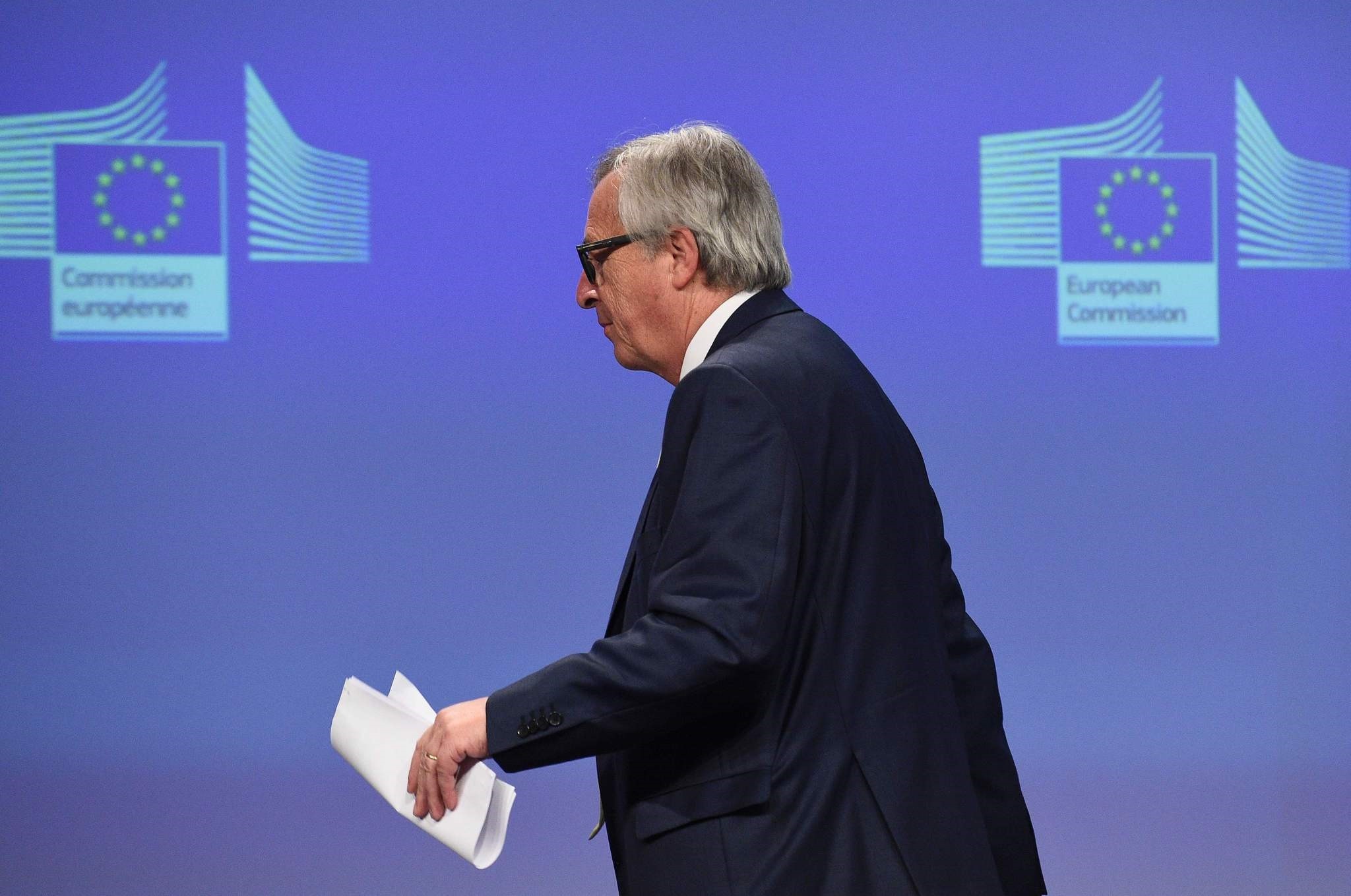 European Commission chief Jean-Claude Juncker leaves after a joint press conference  at the EU Headquarters in Brussels on June 24, 2016. (AFP Photo)