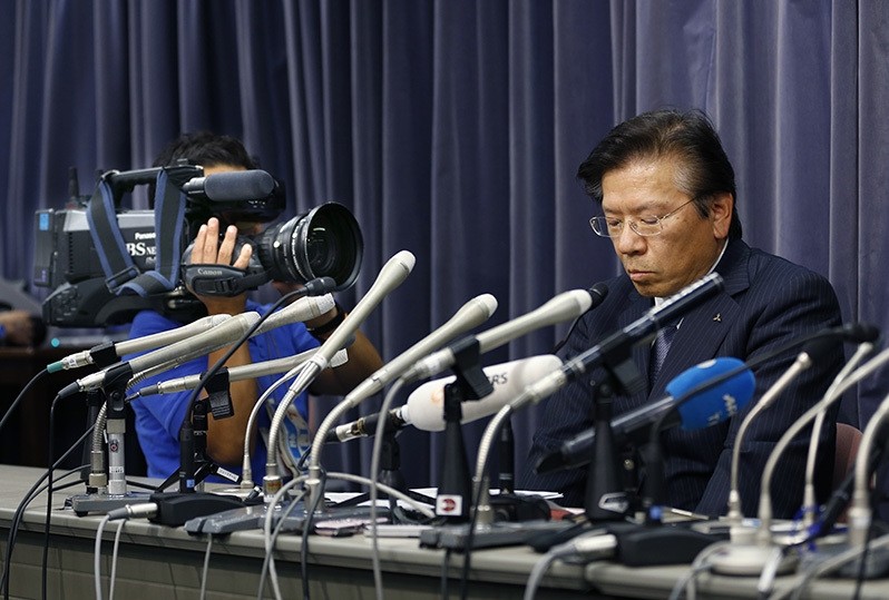 Mitsubishi Motors Corp. President Tetsuro Aikawa listens to a reporter's question during a press conference in Tokyo. (AP Photo)