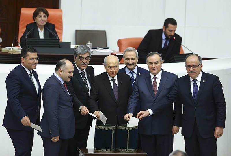 MHP Chair Devlet Bahu00e7eli and MHP lawmakers casting their ballots during the vote for constitutional change at the Turkish parliament (AA Photo)