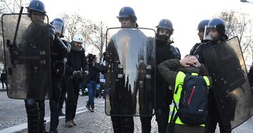 Almost 700 detained as 'Yellow Vest' protesters gather in Paris