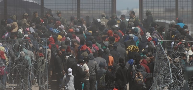 HUNDREDS OF MIGRANTS OVERWHELM NATIONAL GUARD TROOPS ON U.S.-MEXICO BORDER