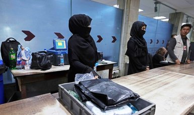 Kabul airport women brave fears to return to work