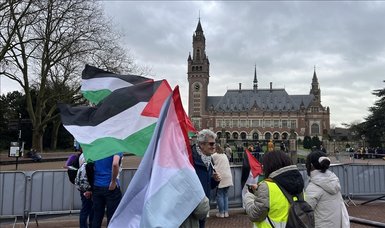 Protesters burn Israeli flag in front of ICJ