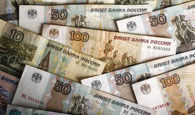Russian rouble holds firm, boosted by central bank currency interventions