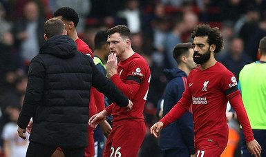 Liverpool left-back Robertson elbowed by assistant referee