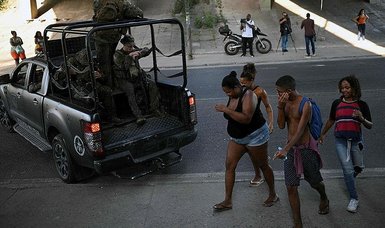 At least 13 dead in latest clash with police outside Rio de Janeiro